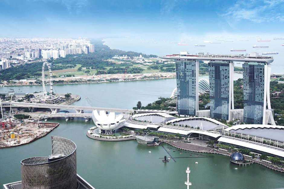 Stunning aerial view of Marina Bay Sands and Singapore skyline on a clear day.